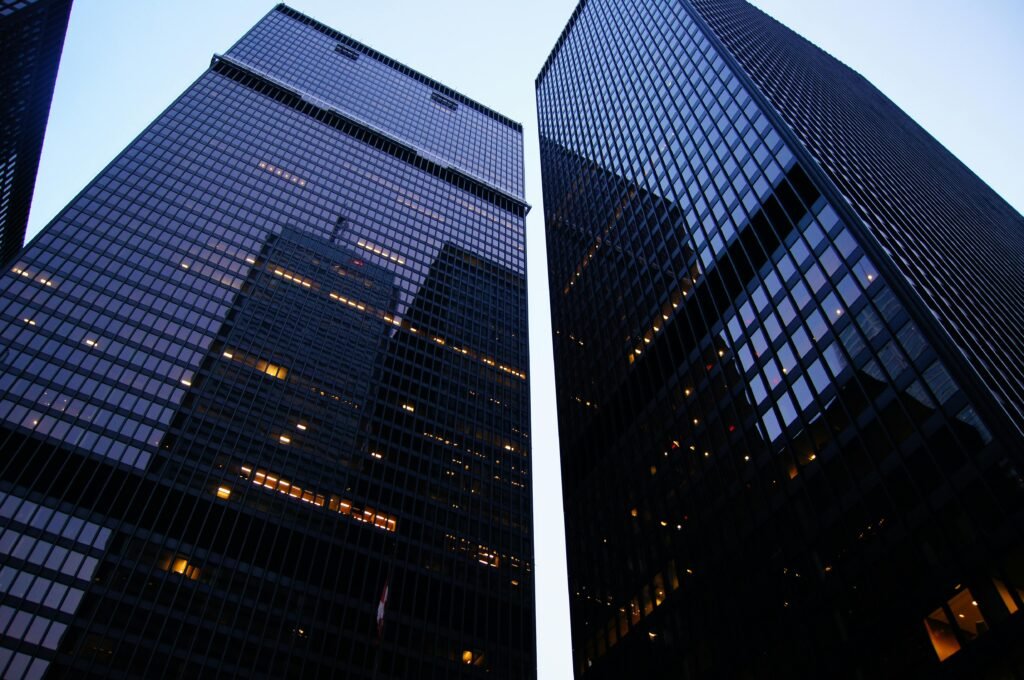 Dramatic low angle view of Toronto's skyscrapers reflecting the evening sky.